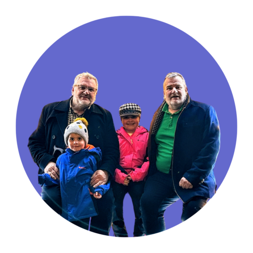 Portrait of David, a kinship carer, his partner and David's two grandchildren.